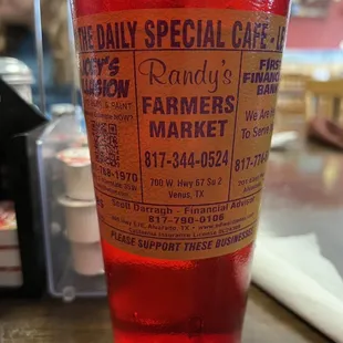 a glass of red liquid