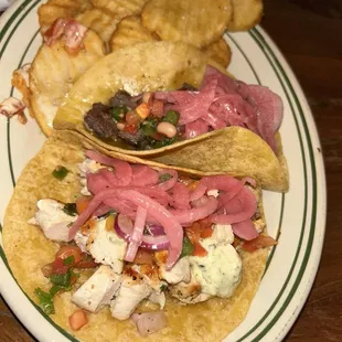 Steak and chicken tacos with a side of waffle fries