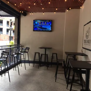 Patio seating including bar height tables and chairs