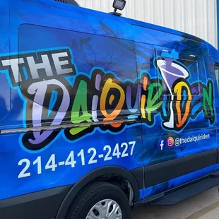 a blue van with graffiti on it