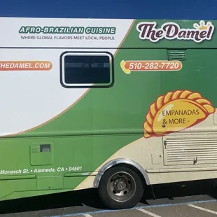 a green and white food truck