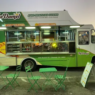 a green and white food truck