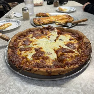 Large pepperoni pizza (the pepperoni is under the mountain of cheese).