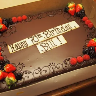 Half sheet Sacher Torte cake, ordered for my dad's 70th birthday party.  Beautiful, and completely delicious.