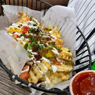 a basket of fries and ketchup
