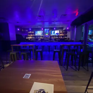 a bar with purple lighting