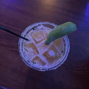 a margarita with a lime garnish