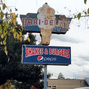 a sign for shakes and burgers