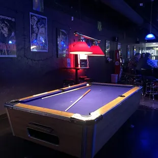 a pool table in a bar