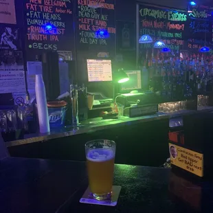 a pint of beer on the bar