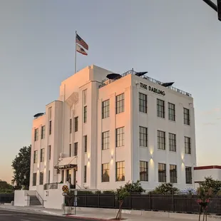 The ol' girl is catching some of the glow of the setting sun as the building lights come on