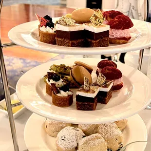 Each person got a separate plate of savories. Top 2 tiers hold 5 desserts and bottom 2 scones per person.