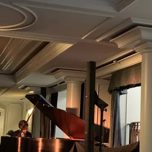 a grand piano in the lounge