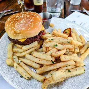 Dawson Burger - American cheese, griddle onion, satyr sauce, house pickles, tomato, sesame bun