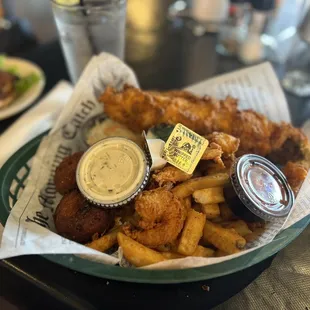 Shrimp, flounder, fries with crab cake aside.