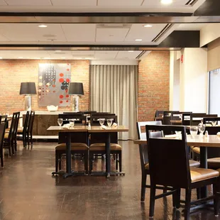 a dining area with tables and chairs