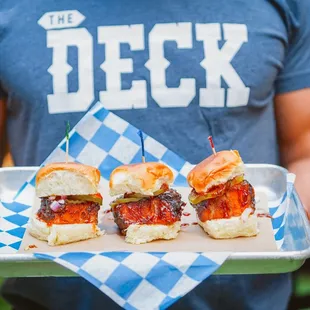 Deck Sliders: smoked brisket, st. louis bbq sauce, coleslaw, fried pickles, hawaiian sweet roll