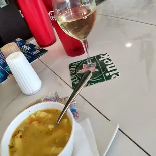 Chicken noodle soup and a house Chardonnay