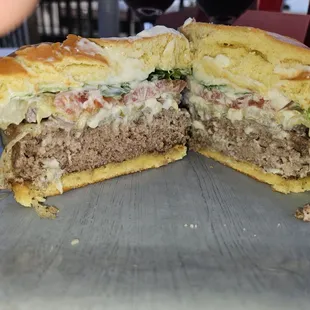 Deck Burger with Swiss, tomato, lettuce, pickle, ketchup and mayonnaise.