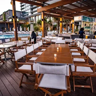 tables and chairs on a wooden deck