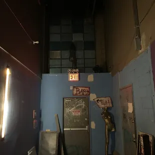 a blue wall with a neon sign