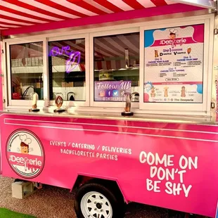a pink ice cream truck