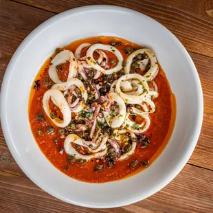 IG: @kenty_eats | Grilled Calamari ala Plancha Domestic calamari, marinara, chili oil, walnuts, lemon, garlic, parsley, fried capers