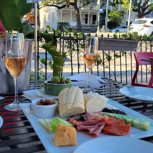 a plate of food and a glass of wine
