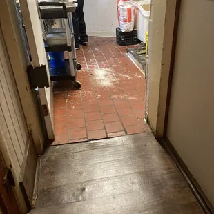 Dirty kitchen right next to the ladies restroom