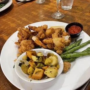 Fried shrimp with roasted vegetables and asparagus