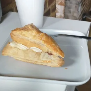 Delicious drip coffee with an excuisite strawberry and cream puff pastry.