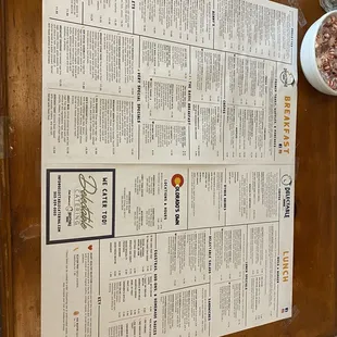 a menu on a wooden table