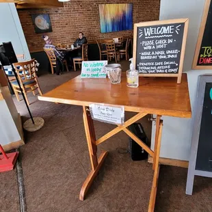 a table with a sign on it