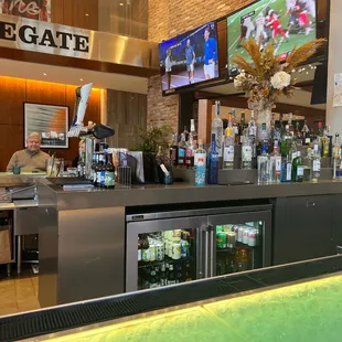 a bar with people sitting at it