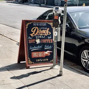 a sign on the sidewalk