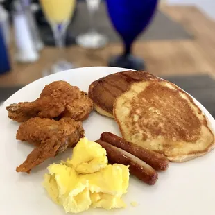 Wings, pancakes, eggs and sausages from the AYCE buffet.