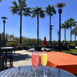 Enjoying Pear and Passionfruit Mimosas in the outdoor seating.