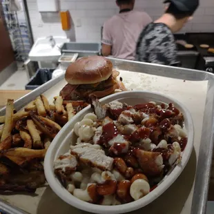 a plate of food and a bowl of fries