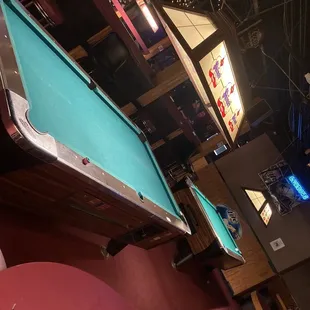 a pool table and a television