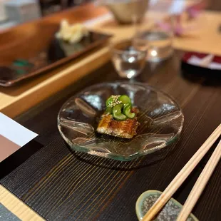 a plate of food and chopsticks