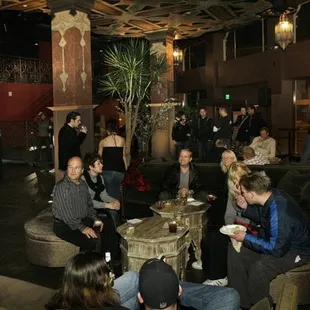 a group of people sitting around a table