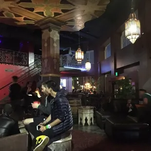 a group of people sitting in a bar