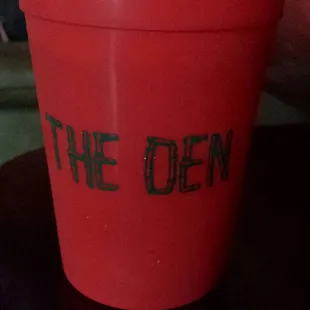 a red cup with a straw in it