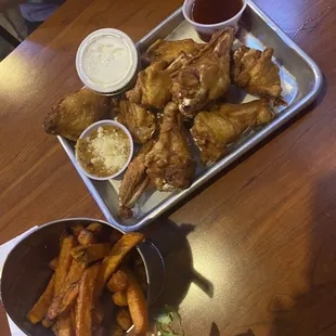 Naked traditional wings and sweet potato fries