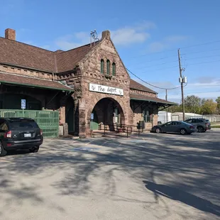 a man standing in front of the station