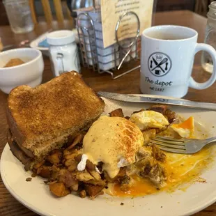 Smoked chicken Benedict with extra toast, great mug of coffee, and a cinnamon muffin.