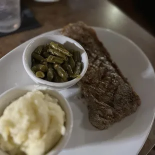 My husband NY strip.  Cold and no grill marks.  Seemed like it was cooked ahead and soaking in water?  sides also cold. $33