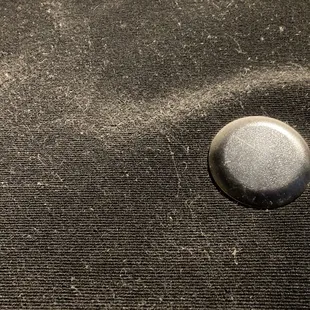 a close up of a metal button