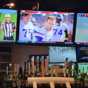 a sports bar with multiple televisions