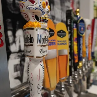 a row of beer taps